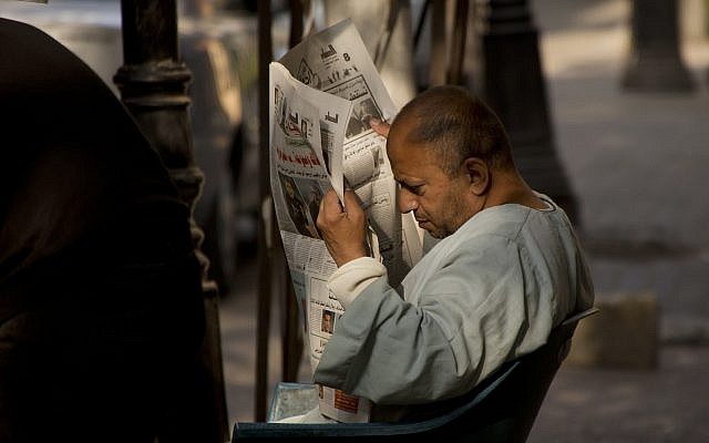 An Egyptian man reads a newspaper in the Zamalek district in Cairo, on October 27, 2016. (AP Photo/Amr Nabil) An Egyptian man reads a newspaper in the Zamalek district in Cairo, on October 27, 2016. (AP Photo/Amr Nabil)