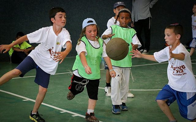 Religious boys playing basketball, June 13, 2016. (Gershon Elinson/FLASH90) Religious boys playing basketball, June 13, 2016. (Gershon Elinson/FLASH90)