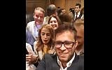 MK Oren Hazan (c) takes a selfie while trapped in an elevator with three other lawmakers and several others on April 25, 2018. (Screen capture: Twitter video)