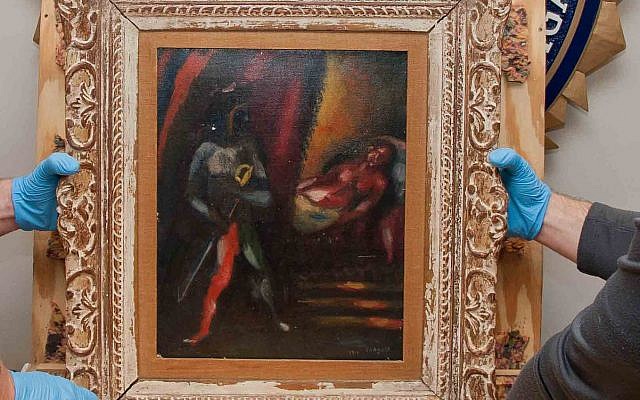 Personnel from the FBI’s Art Crime Team hold a framed work by Marc Chagall, 'Othello and Desdemona,' prior to its return to the owners’ estate nearly 30 years after it was stolen. (FBI) Personnel from the FBI’s Art Crime Team hold a framed work by Marc Chagall, 'Othello and Desdemona,' prior to its return to the owners’ estate nearly 30 years after it was stolen. (FBI)