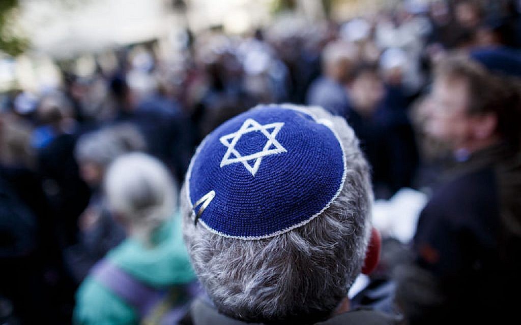 Illustrative: A participant wears a kippah during a 'wear a kippah' gathering to protest against anti-Semitism in front of the Jewish Community House on April 25, 2018 in Berlin, Germany. (Carsten Koall/Getty Images via JTA) Illustrative: A participant wears a kippah during a 'wear a kippah' gathering to protest against anti-Semitism in front of the Jewish Community House on April 25, 2018 in Berlin, Germany. (Carsten Koall/Getty Images via JTA)