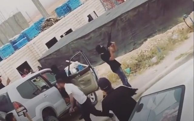 Bedouins seen shooting M-16s into the air on April 20, 2018, during a wedding procession near Ohalim Junction on Route 40. (Screencapture) Bedouins seen shooting M-16s into the air on April 20, 2018, during a wedding procession near Ohalim Junction on Route 40. (Screencapture)