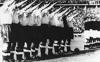 Before a record crowd of more than 100,000 people who filled Berlin's Olympic stadium. the English football team gave the Nazi salute in this May 14th, 1938, file photo. England beat Germany 6-3. (AP PHOTO).