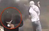 Screen capture from video purporting to show a Palestinian rioter injuring a bystander with a sling he was aiming at Israeli security forces on the border with the Gaza Strip, April 27, 2018. (Twitter)