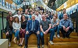 President Reuven Rivlin, left, with Waze CEO Noam Bardin, right, and the Waze team ahead of Israel's Independence Day celebrations, in April 2018. Waze featured President Rivlin's recorded driving tips for Independence Day revelers. (Victor Levy)