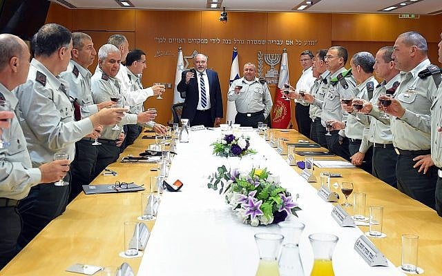 Defense Minister Avigdor Liberman, center, raises a toast with the IDF General Staff at the army's Tel Aviv headquarters on April 16, 2018, in honor of Israel's upcoming Independence Day this week. (Ariel Hermoni/Defense Ministry) Defense Minister Avigdor Liberman, center, raises a toast with the IDF General Staff at the army's Tel Aviv headquarters on April 16, 2018, in honor of Israel's upcoming Independence Day this week. (Ariel Hermoni/Defense Ministry)