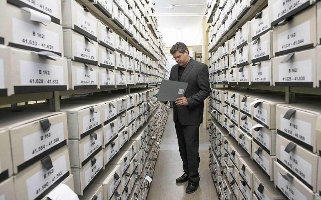 German prosecutor, head of Central Office of the Judicial Authorities of the Federal States for the Investigation of National Socialist Crimes, Jens Rommel stands in the archives room of the institution on April 19, 2018 in Ludwigsburg, southwestern Germany. (AFP PHOTO / THOMAS KIENZLE) German prosecutor, head of Central Office of the Judicial Authorities of the Federal States for the Investigation of National Socialist Crimes, Jens Rommel stands in the archives room of the institution on April 19, 2018 in Ludwigsburg, southwestern Germany. (AFP PHOTO / THOMAS KIENZLE)