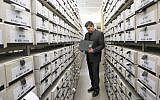 German prosecutor, head of Central Office of the Judicial Authorities of the Federal States for the Investigation of National Socialist Crimes, Jens Rommel stands in the archives room of the institution on April 19, 2018 in Ludwigsburg, southwestern Germany. (AFP PHOTO / THOMAS KIENZLE)