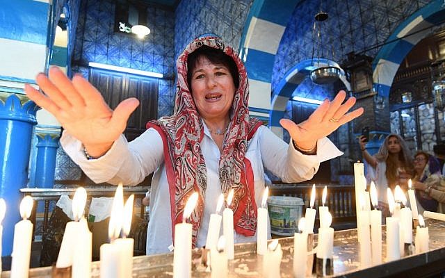Jewish pilgrims take part in the annual pilgrimage at the Ghriba synagogue in the Tunisian resort island of Djerba on May 2, 2018. (AFP/Fethi Belaid) Jewish pilgrims take part in the annual pilgrimage at the Ghriba synagogue in the Tunisian resort island of Djerba on May 2, 2018. (AFP/Fethi Belaid)