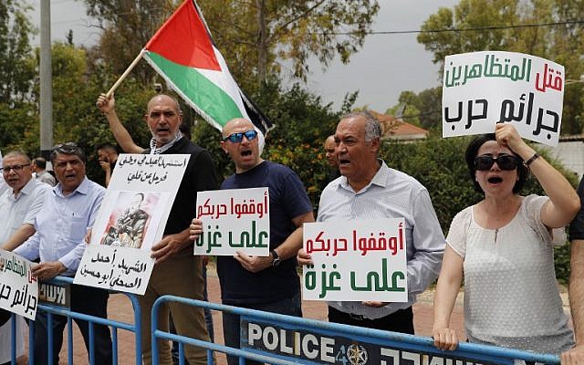 Joint (Arab) List MK Hanin Zoabi (R) takes part in a solidarity demonstration with the weekly "March of Return" clashes in the Gaza Strip, on May 4, 2018, near the Erez border crossing with Gaza. (AFP Photo/Ahmad Gharabli)