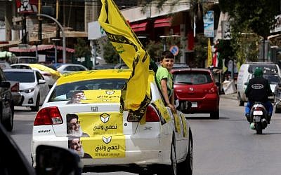 Hezbollah supporters tour the city of Nabatieh in southern Lebanon on May 6, 2018, as the country voted in its first parliamentary elections in nine years. (AFP Photo/Mahmoud Zayyat)