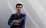In this photo taken on August 30, 2010 Iranian film director Jafar Panahi poses during an interview with AFP in Tehran. (AFP/Atta Kenare)