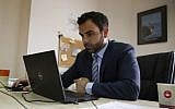 Human Rights Watch's Israel and Palestine director Omar Shakir at his office in the West Bank city of Ramallah on May 9, 2018. (AFP Photo/Abbas Momani)