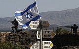 An Israeli flag is seen placed on Mount Bental in the  Golan Heights on May 10, 2018.( AFP PHOTO / JALAA MAREY)