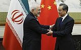 Chinese State Councillor and Foreign Minister Wang Yi (R) meets Iran's Foreign Minister Mohammad Javad Zarif at the Diaoyutai state guesthouse in Beijing on May 13, 2018. (AFP PHOTO / POOL / THOMAS PETER)