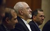 Iranian Foreign Minister Mohammad Javad Zarif holds talks with Chinese State Councillor and Foreign Minister Wang Yi (not pictured) at the Diaoyutai state guesthouse in Beijing on May 13, 2018. (AFP Photo/Pool/Thomas Peter)