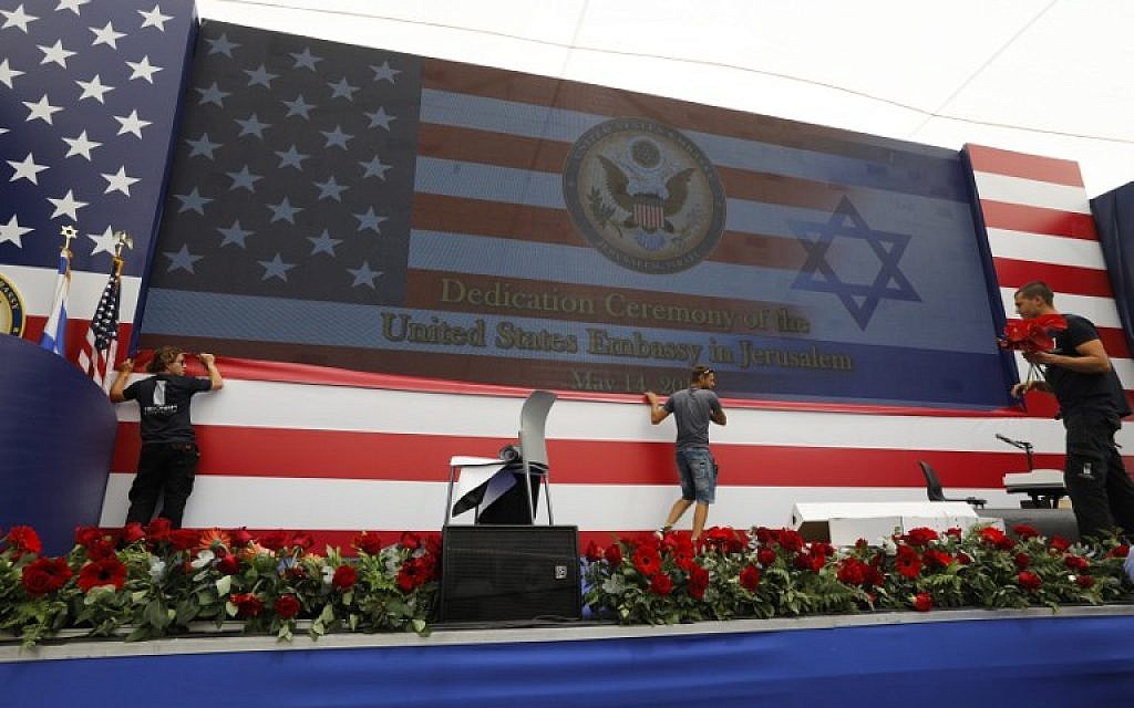 Embassy staff prepare the stage ahead of the inauguration of the US embassy in Jerusalem on May 14, 2018. (AFP PHOTO / Menahem KAHANA)