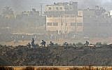 Israeli soldiers holding positions opposite Palestinian protesters gathering along the border fence between the Gaza Strip and Israel, May 14, 2018. (JACK GUEZ/AFP)