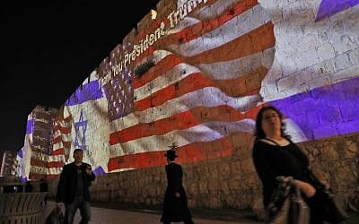 The Israeli and United States flags are projected on the walls of the ramparts of Jerusalem's Old City, to mark the opening of the new US embassy on May 14, 2018. 
(AFP/Ahmad GHARABLI)