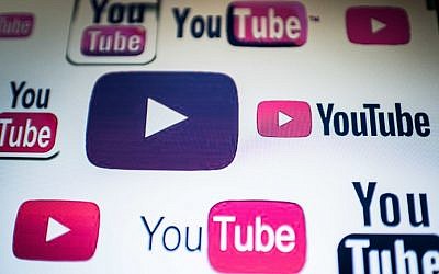 This photo illustration taken on March 23, 2018, shows YouTube logos on a computer screen in Beijing. (AFP Photo/Nicolas Asfouri)