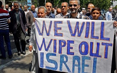 Iranians hold a banner with an anti-Israel message in the capital Tehran on May 18, 2018, as they take part in an anti-US and Israel demonstration after weekly Friday prayers. (AFP/Stringer)