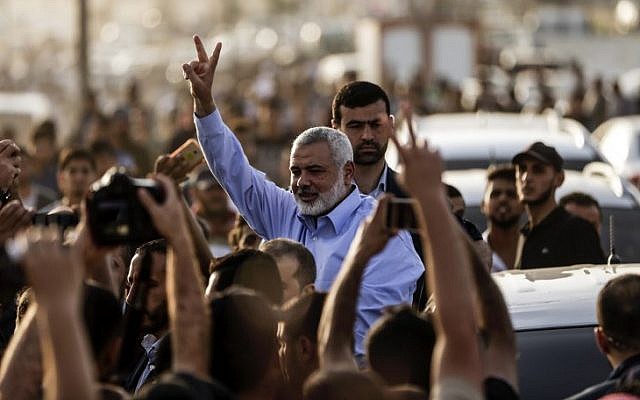 Ismail Haniyeh, the head of Hamas, gestures to demonstrators at a a protest camp during clashes with Israeli forces along the border with the Gaza Strip east of Gaza City on May 18, 2018. (AFP Photo/Mahmud Hams) Ismail Haniyeh, the head of Hamas, gestures to demonstrators at a a protest camp during clashes with Israeli forces along the border with the Gaza Strip east of Gaza City on May 18, 2018. (AFP Photo/Mahmud Hams)