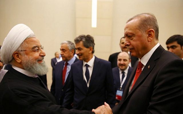 Turkish President Tayyip Erdogan (R) shakes hands with his Iranian counterpart Hassan Rouhani during an extraordinary meeting of the Organization of Islamic Cooperation (OIC) in Istanbul on May 18, 2018. (AFP PHOTO / POOL / Kayhan OZER) Turkish President Tayyip Erdogan (R) shakes hands with his Iranian counterpart Hassan Rouhani during an extraordinary meeting of the Organization of Islamic Cooperation (OIC) in Istanbul on May 18, 2018. (AFP PHOTO / POOL / Kayhan OZER)