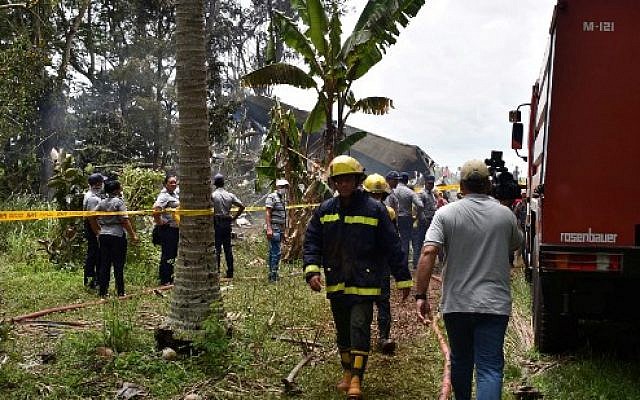Emergency and rescue personnel are pictured while working at the site of the accident, after a Cubana de Aviacion aircraft crashed after taking off from Havana's Jose Marti airport on May 18, 2018. (AFP PHOTO / STR) Emergency and rescue personnel are pictured while working at the site of the accident, after a Cubana de Aviacion aircraft crashed after taking off from Havana's Jose Marti airport on May 18, 2018. (AFP PHOTO / STR)