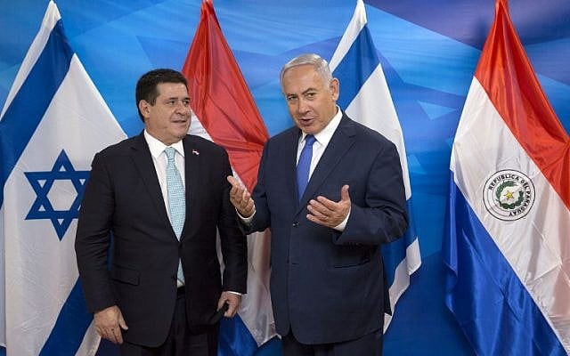 Israeli Prime Minister Benjamin Netanyahu (R) meets with Paraguayan President Horacio Cartes at the Prime Minister's office in Jerusalem on May 21, 2018. (AFP/POOL/Sebastian Scheiner) Israeli Prime Minister Benjamin Netanyahu (R) meets with Paraguayan President Horacio Cartes at the Prime Minister's office in Jerusalem on May 21, 2018. (AFP/POOL/Sebastian Scheiner)