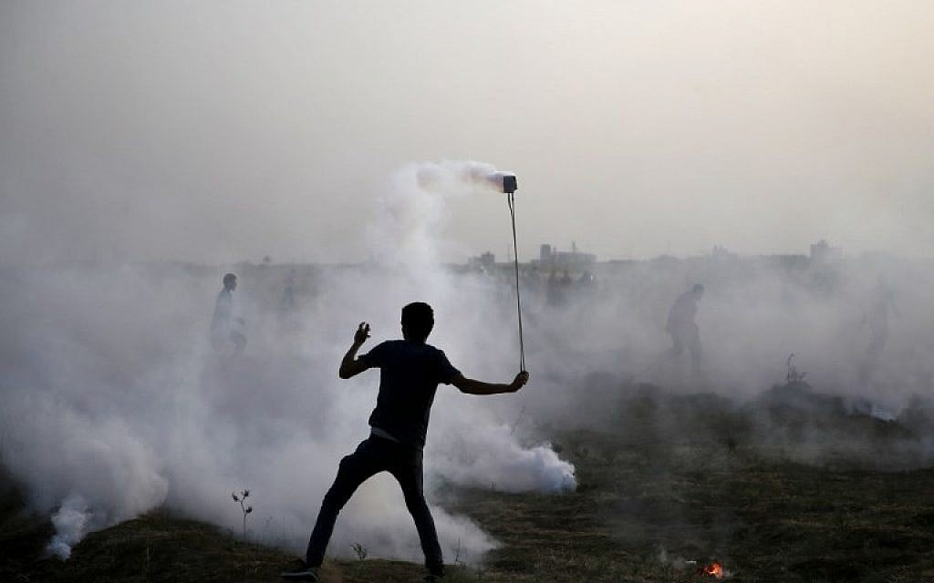 Illustrative image of a Palestinian protester at a demonstration along the border between Israel and the Gaza Strip, east of Gaza City, on May 25, 2018. (AFP/Mohammed Abed)