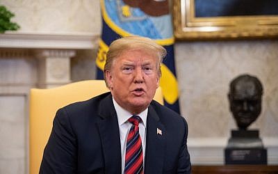 US President Donald Trump speaks to the press with Joshua Holt (out of frame), who had been detained in Venezuela for two years, in the Oval Office at the White House in Washington, DC, on May 26, 2018 (PHOTO / NICHOLAS KAMM)