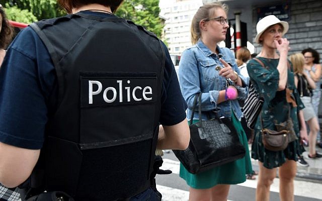 A police officer speaks with parents of children at a nearby high school in the eastern Belgian city of Liege on May 29, 2018, after a gunman shot dead three people, two of them policemen, before being killed by elite officers. (AFP PHOTO / JOHN THYS) A police officer speaks with parents of children at a nearby high school in the eastern Belgian city of Liege on May 29, 2018, after a gunman shot dead three people, two of them policemen, before being killed by elite officers. (AFP PHOTO / JOHN THYS)