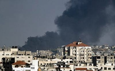 A photo taken from Gaza City on May 29, 2018, shows smoke billowing in the background following an Israeli air strike against a military target in the Palestinian coastal enclave, in response to repeated mortar and rocket attacks on southern Israel. (AFP/Thomas Coex)