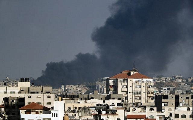 A photo taken from Gaza City on May 29, 2018, shows smoke billowing in the background following an Israeli air strike against a military target in the Palestinian coastal enclave, in response to repeated mortar and rocket attacks on southern Israel. (AFP/Thomas Coex) A photo taken from Gaza City on May 29, 2018, shows smoke billowing in the background following an Israeli air strike against a military target in the Palestinian coastal enclave, in response to repeated mortar and rocket attacks on southern Israel. (AFP/Thomas Coex)