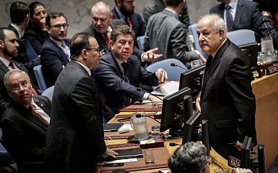 Kuwait's Ambassador to the United Nations Mansour Al-Otaibi, left, talks to Permanent Observer of Palestine to the United Nations Riyad Mansour at the start of a UN Security Council meeting, May 15, 2018 in New York. (Drew Angerer/Getty Images/AFP)