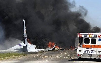 Flames and smoke rise from an Air National Guard C-130 cargo plane after it crashed near Savannah, Ga., Wednesday, May 2, 2018. (James Lavine via AP)