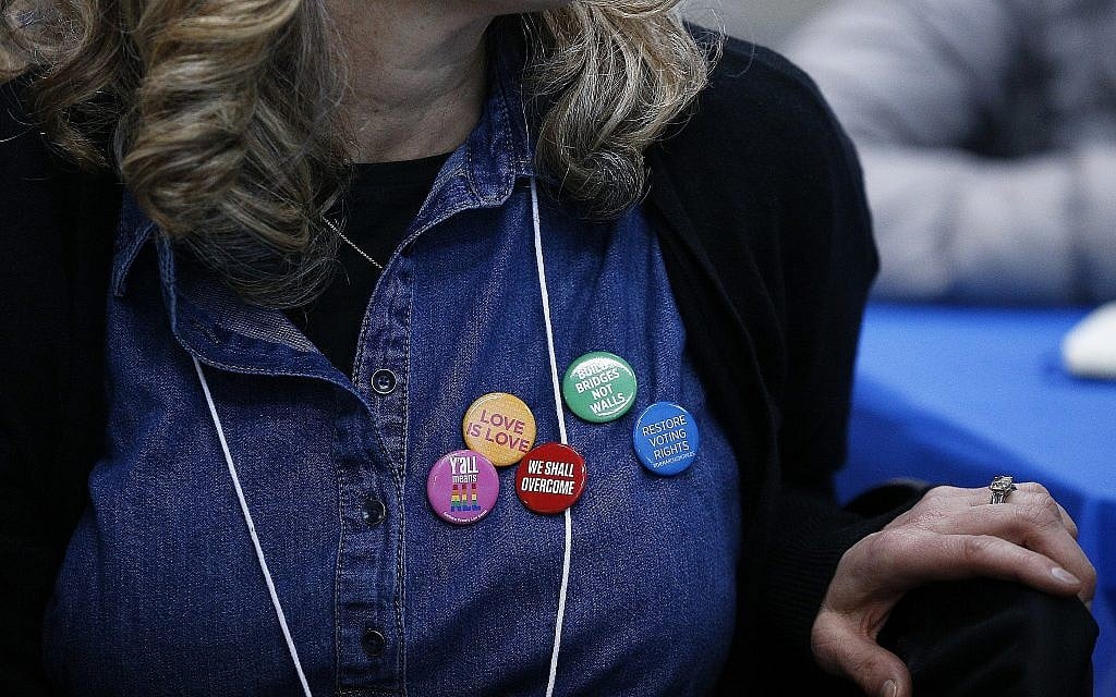 A member of the Sisterhood of Salaam Shalom group wears politically-themed buttons during a visit to the McRae Learning Center in Selma, Alabama, April, 24, 2018. (Brynn Anderson/AP) A member of the Sisterhood of Salaam Shalom group wears politically-themed buttons during a visit to the McRae Learning Center in Selma, Alabama, April, 24, 2018. (Brynn Anderson/AP)