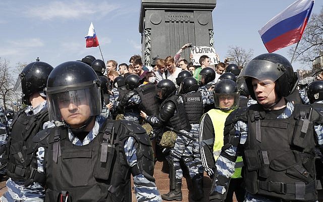 Russian police push protesters back during a demonstration against President Vladimir Putin in Pushkin Square in Moscow, Russia, Saturday, May 5, 2018. (AP Photo/Pavel Golovkin) Russian police push protesters back during a demonstration against President Vladimir Putin in Pushkin Square in Moscow, Russia, Saturday, May 5, 2018. (AP Photo/Pavel Golovkin)