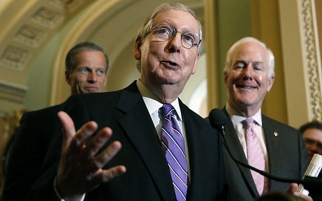 Senate Majority Leader Mitch McConnell of Kentucky, center, on Capitol Hill, May 8, 2018 in Washington. McConnell is accompanied by Sen. John Thune, R-South Dakota, left, and Sen. John Cornyn, R-Texas. (AP Photo/Alex Brandon)