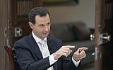 Syrian President Bashar Assad speaks during an interview with the Greek Kathimerini newspaper, in Damascus, Syria, in this photo released May 10, 2018. (SANA via AP)