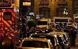 Police officers cordon off the area after a knife attack in central Paris, May 12, 2018. (AP/Thibault Camus)