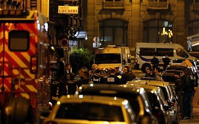 Police officers cordon off the area after a knife attack in central Paris, May 12, 2018. (AP/Thibault Camus)