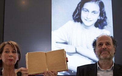 Teresien da Silva, left, and Ronald Leopold of the Anne Frank Foundation show a facsimile of Anne Frank's diary with two pages taped off during a press conference at the foundation's office in Amsterdam, Netherlands, Tuesday, May 15, 2018. (AP Photo/Peter Dejong) Teresien da Silva, left, and Ronald Leopold of the Anne Frank Foundation show a facsimile of Anne Frank's diary with two pages taped off during a press conference at the foundation's office in Amsterdam, Netherlands, Tuesday, May 15, 2018. (AP Photo/Peter Dejong)