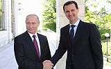 Russian President Vladimir Putin (left) shakes hands with Syrian President Bashar Assad during their meeting in the Black Sea resort of Sochi, Russia, on May 17, 2018. (Mikhail Klimentyev, Sputnik, Kremlin Pool Photo via AP)