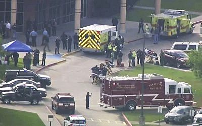 In this image taken from video, emergency personnel and law enforcement officers respond to a high school near Houston after an active shooter was reported on campus, on May 18, 2018, in Santa Fe, Texas. (KTRK-TV ABC13 via AP)