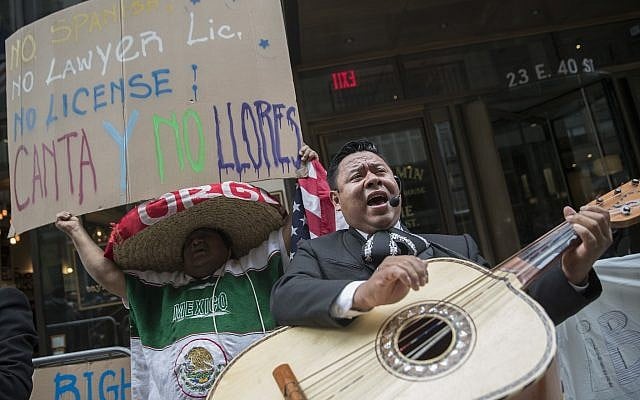 A demonstrator dances and sings along the Mariachi Tapatio de Alvaro Paulino band as they perform during a demonstration across the street from the building that once housed the office space of Aaron Schlossberg, Friday, May 18, 2018, in New York. (AP /Mary Altaffer) A demonstrator dances and sings along the Mariachi Tapatio de Alvaro Paulino band as they perform during a demonstration across the street from the building that once housed the office space of Aaron Schlossberg, Friday, May 18, 2018, in New York. (AP /Mary Altaffer)