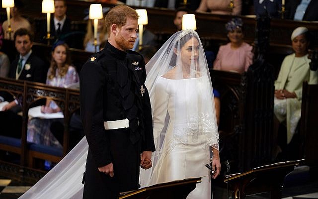 Britain's Prince Harry and Meghan Markle stand, prior to the start of their wedding ceremony, at St. George's Chapel in Windsor Castle in Windsor, near London, England, Saturday, May 19, 2018. (Dominic Lipinski/pool photo via AP) Britain's Prince Harry and Meghan Markle stand, prior to the start of their wedding ceremony, at St. George's Chapel in Windsor Castle in Windsor, near London, England, Saturday, May 19, 2018. (Dominic Lipinski/pool photo via AP)