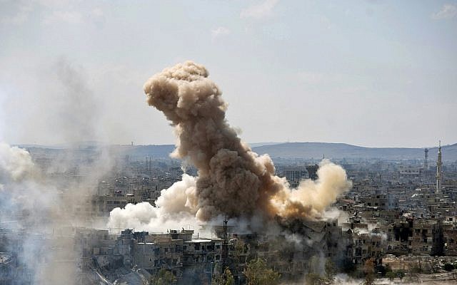 In this file photo released on Sunday, April 22, 2018 by the Syrian official news agency SANA, smoke rises after Syrian government airstrikes and shelling hit in Hajar al-Aswad neighborhood held by Islamic State militants, southern Damascus, Syria. (SANA via AP) In this file photo released on Sunday, April 22, 2018 by the Syrian official news agency SANA, smoke rises after Syrian government airstrikes and shelling hit in Hajar al-Aswad neighborhood held by Islamic State militants, southern Damascus, Syria. (SANA via AP)
