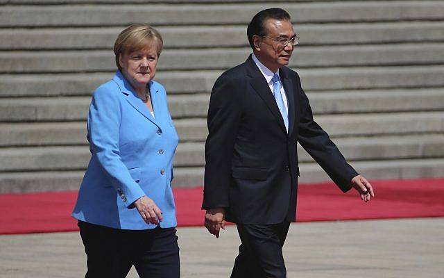 German Chancellor Angela Merkel, left, and Chinese Premier Li Keqiang walk during a welcoming ceremony at the Great Hall of the People in Beijing, May 24, 2018. (Wu Hong/Pool Photo via AP) German Chancellor Angela Merkel, left, and Chinese Premier Li Keqiang walk during a welcoming ceremony at the Great Hall of the People in Beijing, May 24, 2018. (Wu Hong/Pool Photo via AP)