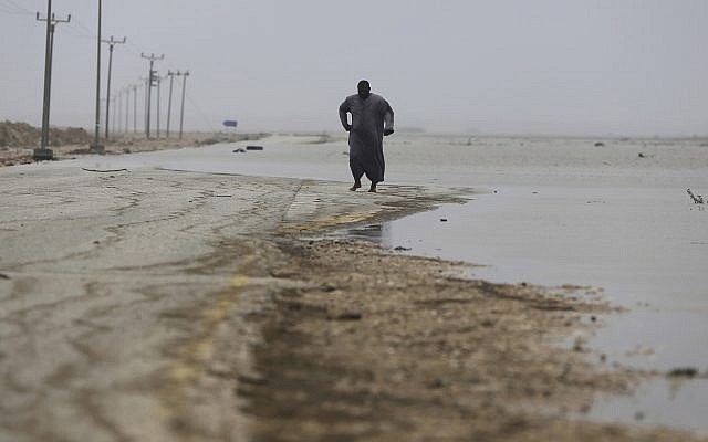 An Omani man walks on a road covered by floodwaters after Cyclone Merkunu in Salalah, Oman, Saturday, May 26, 2018. (AP Photo/Kamran Jebreili) An Omani man walks on a road covered by floodwaters after Cyclone Merkunu in Salalah, Oman, Saturday, May 26, 2018. (AP Photo/Kamran Jebreili)